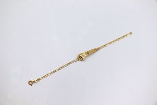 ESCLAVA DE NIÑO MEDUSA Y GRECA. Oro 18k.