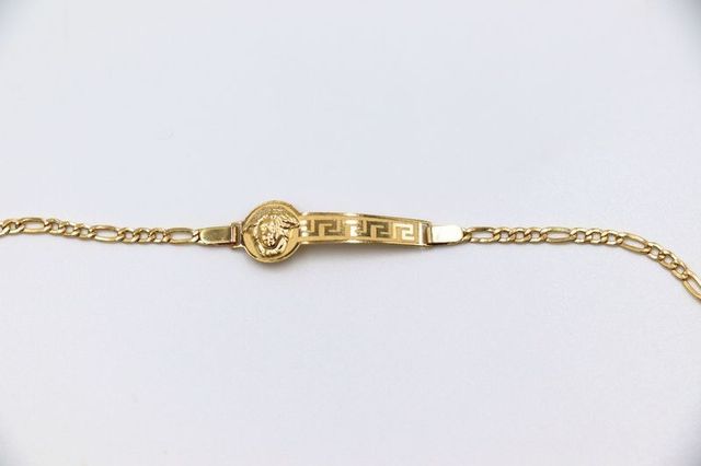 ESCLAVA DE NIÑO MEDUSA Y GRECA. Oro 18k.