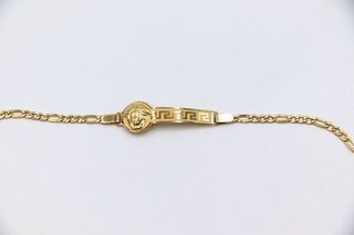 ESCLAVA DE NIÑO MEDUSA Y GRECA. Oro 18k.