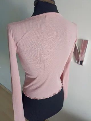 Camiseta rosa de manga larga con cordones