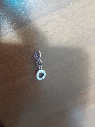 Charm infinito multicolor e argento
