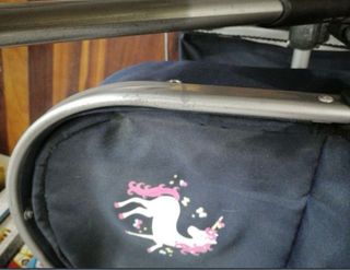 Cochecito de juguete con capota y bolso