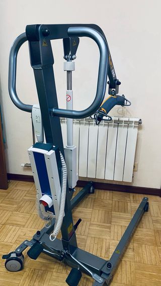 Grúa eléctrica con arnés