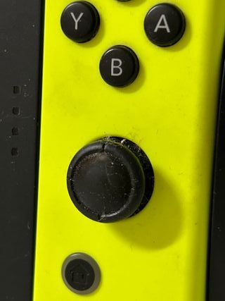 Nintendo Switch soporte y mandos verde y gris