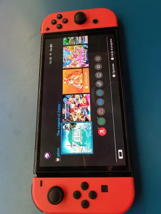 Nintendo Switch Mario Rojo + 2 fundas + monopoly