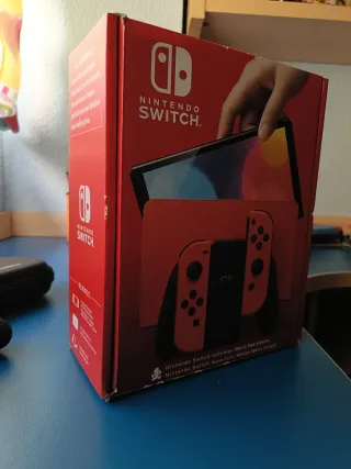 Nintendo Switch Mario Rojo + 2 fundas + monopoly
