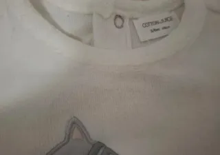 Pijama bebé blanco con gatito.