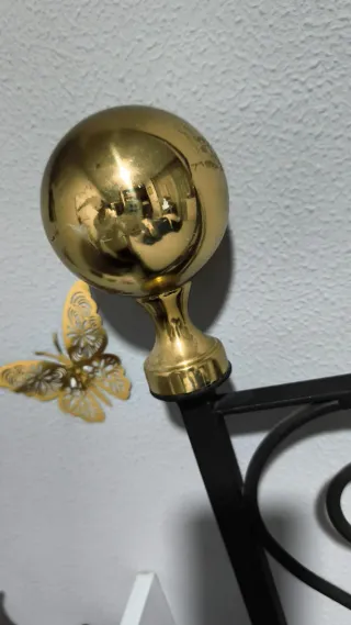 Cabecero de hierro forjado negro y dorado