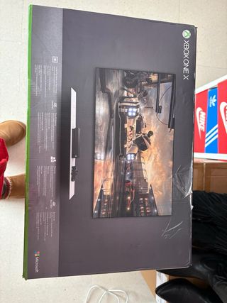 Caja Xbox One X 1TB con manuales