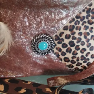 Bolso piel efecto metalizado animal print