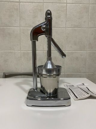 Esprimidor manual de acero