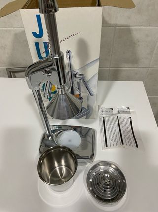 Esprimidor manual de acero