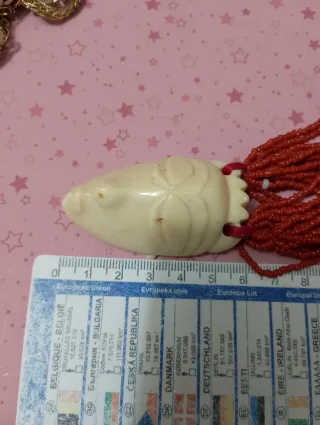 Preziosa collana antica con maschera