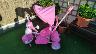 Triciclo niña rosa con sombrilla