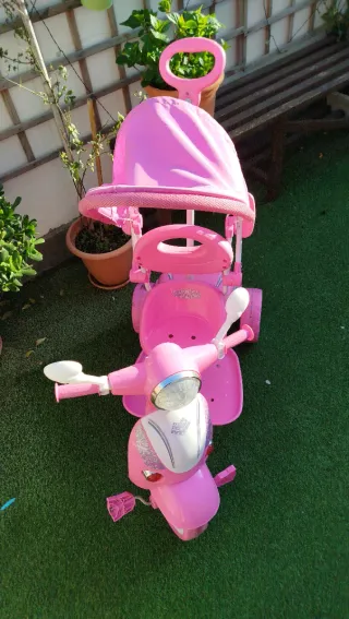 Triciclo niña rosa con sombrilla
