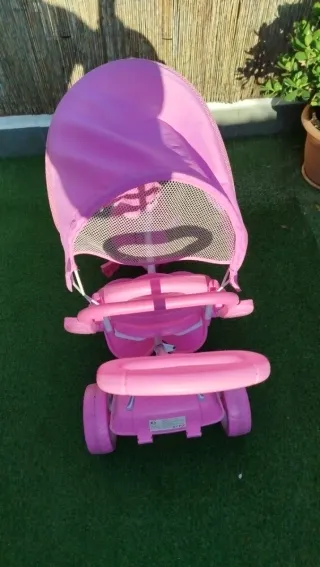 Triciclo niña rosa con sombrilla