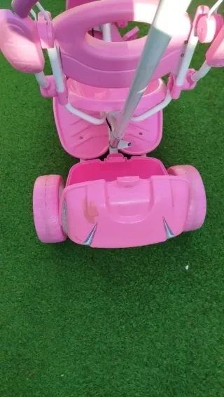 Triciclo niña rosa con sombrilla