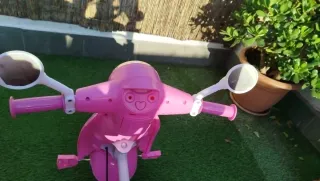 Triciclo niña rosa con sombrilla