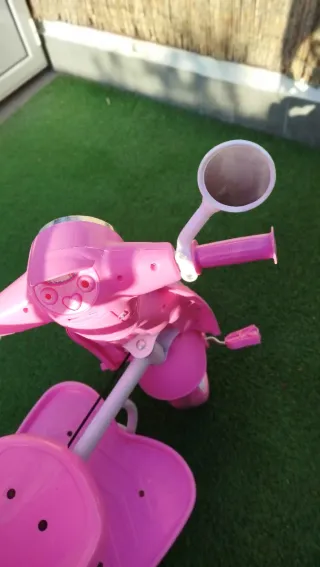 Triciclo niña rosa con sombrilla