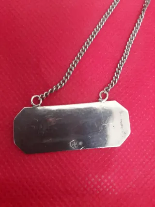 Set di tre placche per bottiglie di liquore in argento sterling