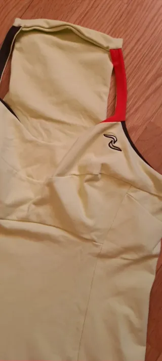 Conjunto deportivo Naffta verde y naranja