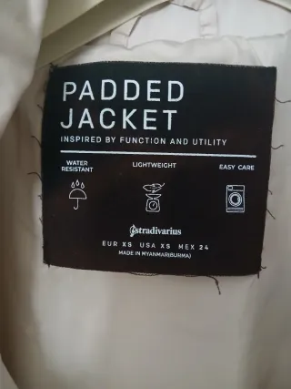 Chaleco acolchado sin mangas beige.Antiagua