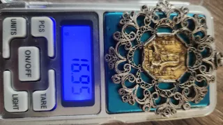 Medalla relicario oro y plata