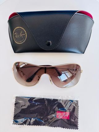 Gafas de sol Ray-Ban doradas y marrones