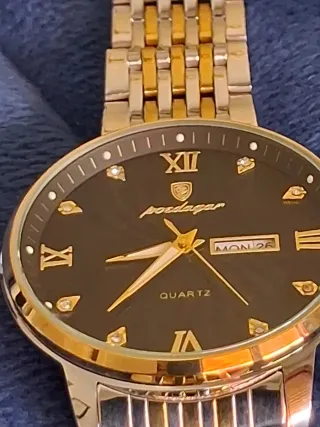 Reloj Poedagar Negro y Dorado Nuevo