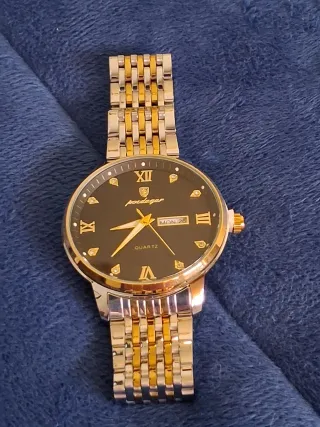 Reloj Poedagar Negro y Dorado Nuevo