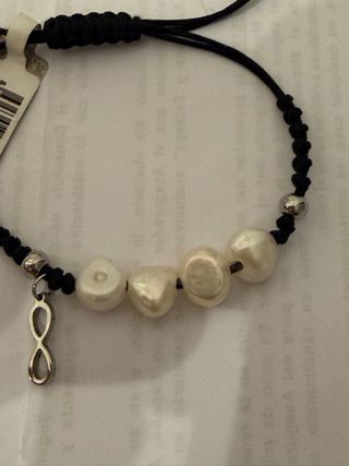 Pulsera de perlas y acero con símbolo infinito
