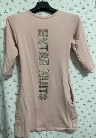 Vestido blanco con volantes y lazada