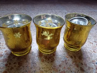 3 portavelas dorados de cristal