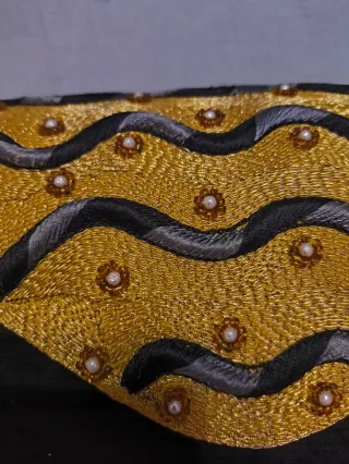 Bolso de fiesta ondas dorado y negro