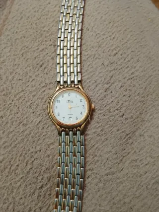 Reloj Lotus Oro y Plata