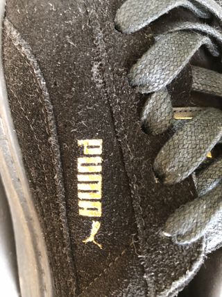 Sneakers Puma nere con punta oro