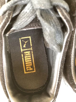 Sneakers Puma nere con punta oro