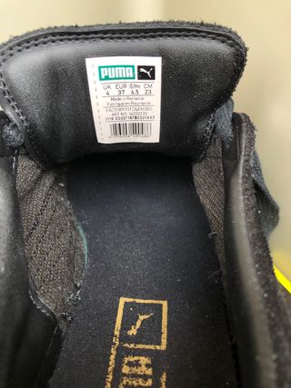 Sneakers Puma nere con punta oro
