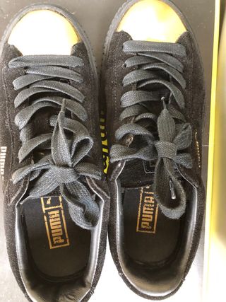 Sneakers Puma nere con punta oro