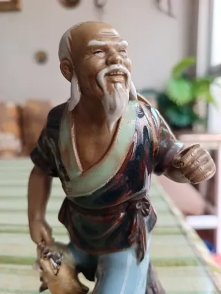 Figura porcelana pescador chino