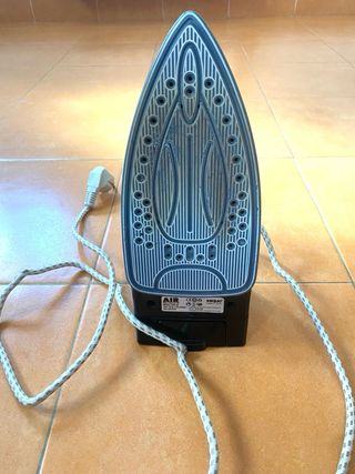 Plancha de vapor verde y negra