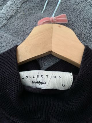 Suéter negro de punto con botones