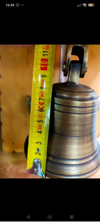 Campana de bronce náutica con ancla