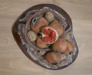 Decoración centro mesa con granadas y nueces