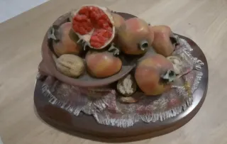 Decoración centro mesa con granadas y nueces