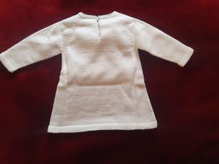 Vestido de bebé blanco con lazo amarillo