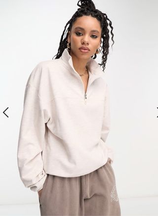 Jersey beige con cremallera