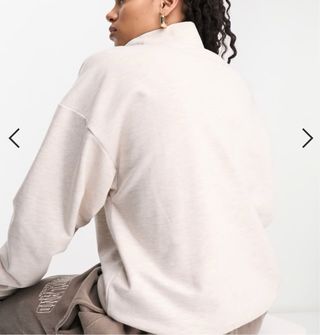 Jersey beige con cremallera