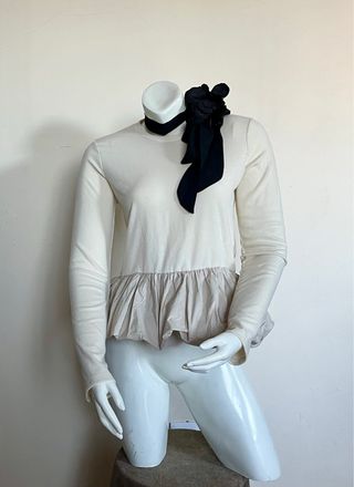 Top peplum de punto