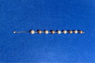 Pulsera Orquídea Oro y Blanco